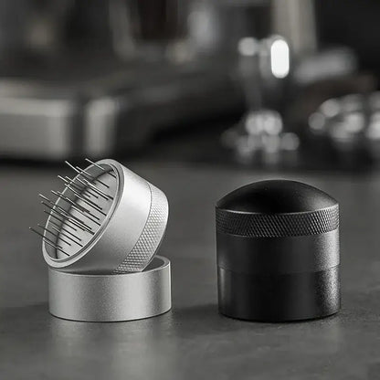 Silver and black decorbites coffee needle distributor with textured grips and fine metal tines for espresso stirring
