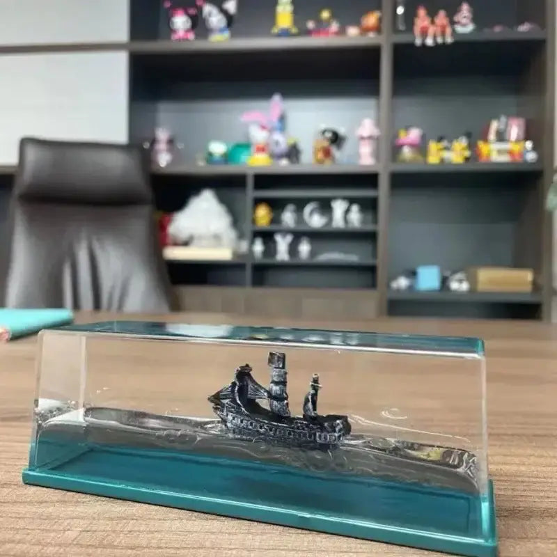 Black pearl pirate ship model encased in clear glass display with teal base ideal for decorbites black pearl office decor