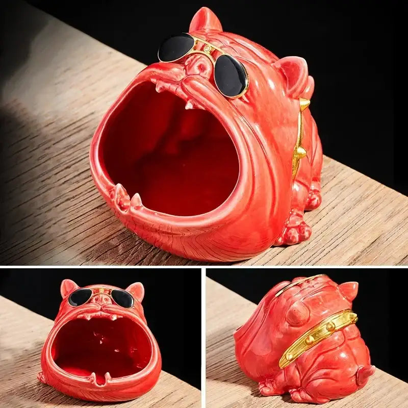 A vibrant red bulldog ceramic ashtray with gold-rimmed sunglasses and collar designed as a living room accessory