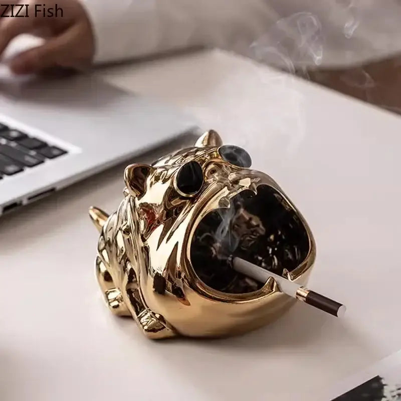 Golden tiger-shaped ceramic ashtray with black glass eyes and cigarette in mouth as bulldog ceramic ashtray living room accessory
