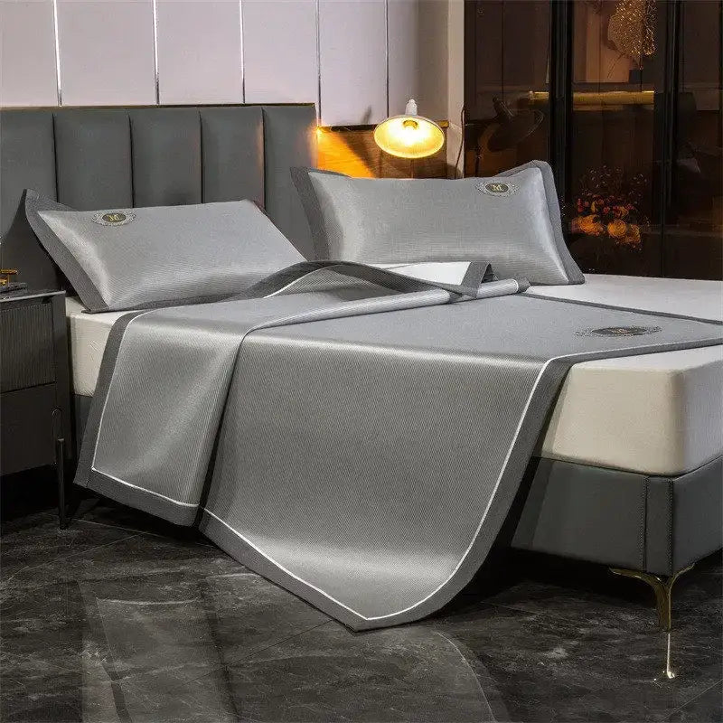 Silver-colored decorbites carbon light cooling bed sheet set with textured light cooling mat and matching pillowcases