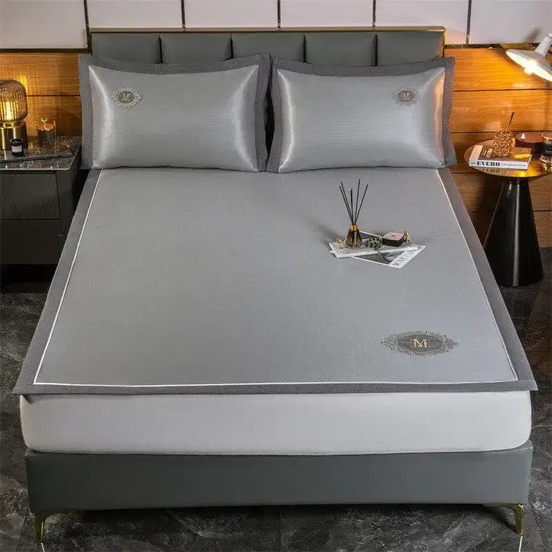 Gray satin bed sheet with subtle texture and embroidered monogram in silver carbon light cooling breathable set decorbites carbon light