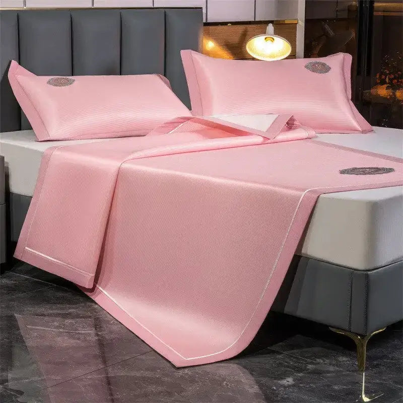 Pink satin-like bed set with embroidered motifs featuring decorbites carbon light cooling mat for breathable comfort