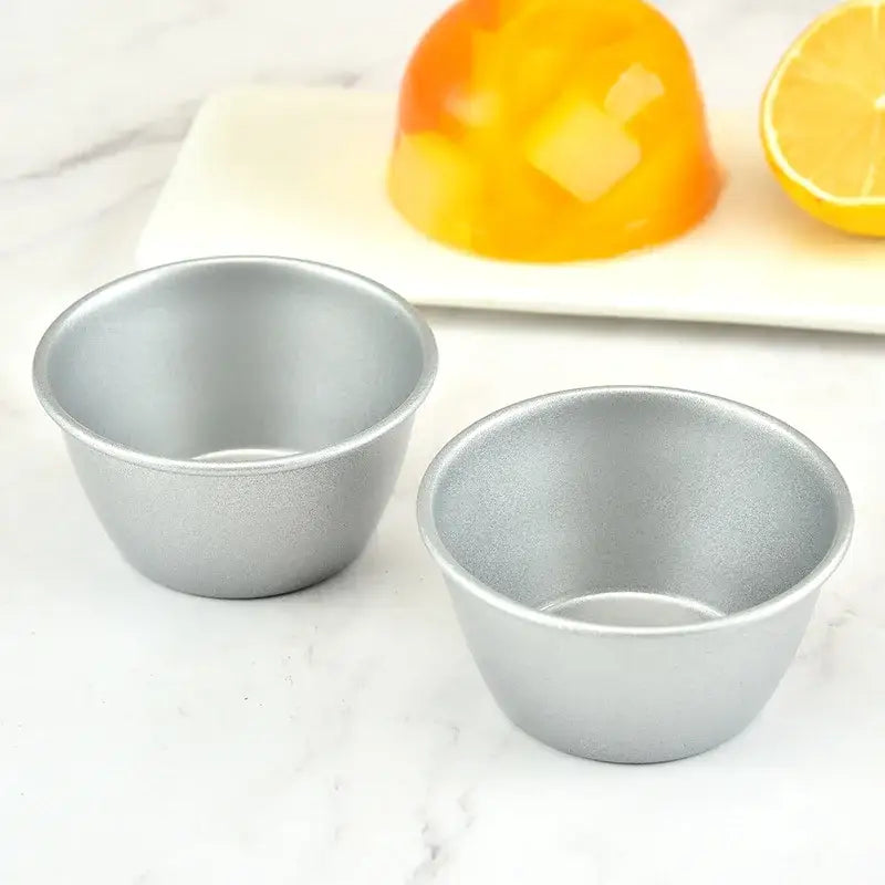 Two silver carbon steel cake molds with matte finish and smooth interior for mini round cups by decorbites carbon steel