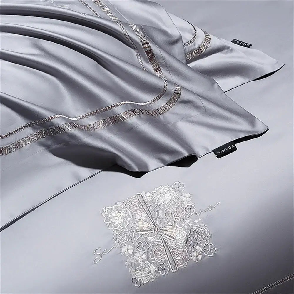 Silver satin pillowcase with delicate floral embroidery and metallic thread in cotton satin jacquard bedding set decorbites