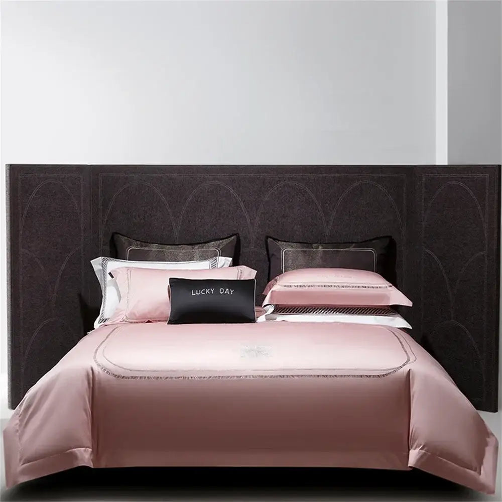 Pink satin bedding set with matching pillowcases and black lucky day accent pillow in decorbites cotton satin jacquard