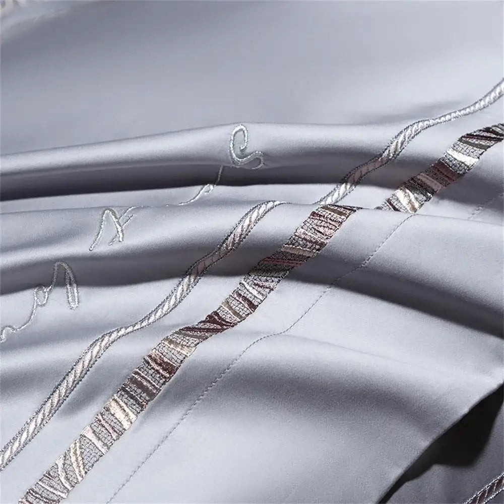 Light gray cotton satin jacquard bedding set with silver metallic thread embroidery and textured wave patterns by decorbites