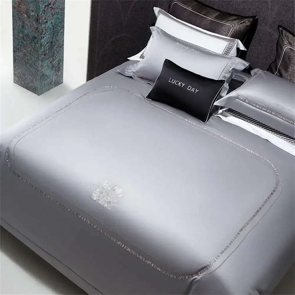 Silver cotton satin jacquard bedding set with subtle embroidered floral design and delicate beaded trim by decorbites