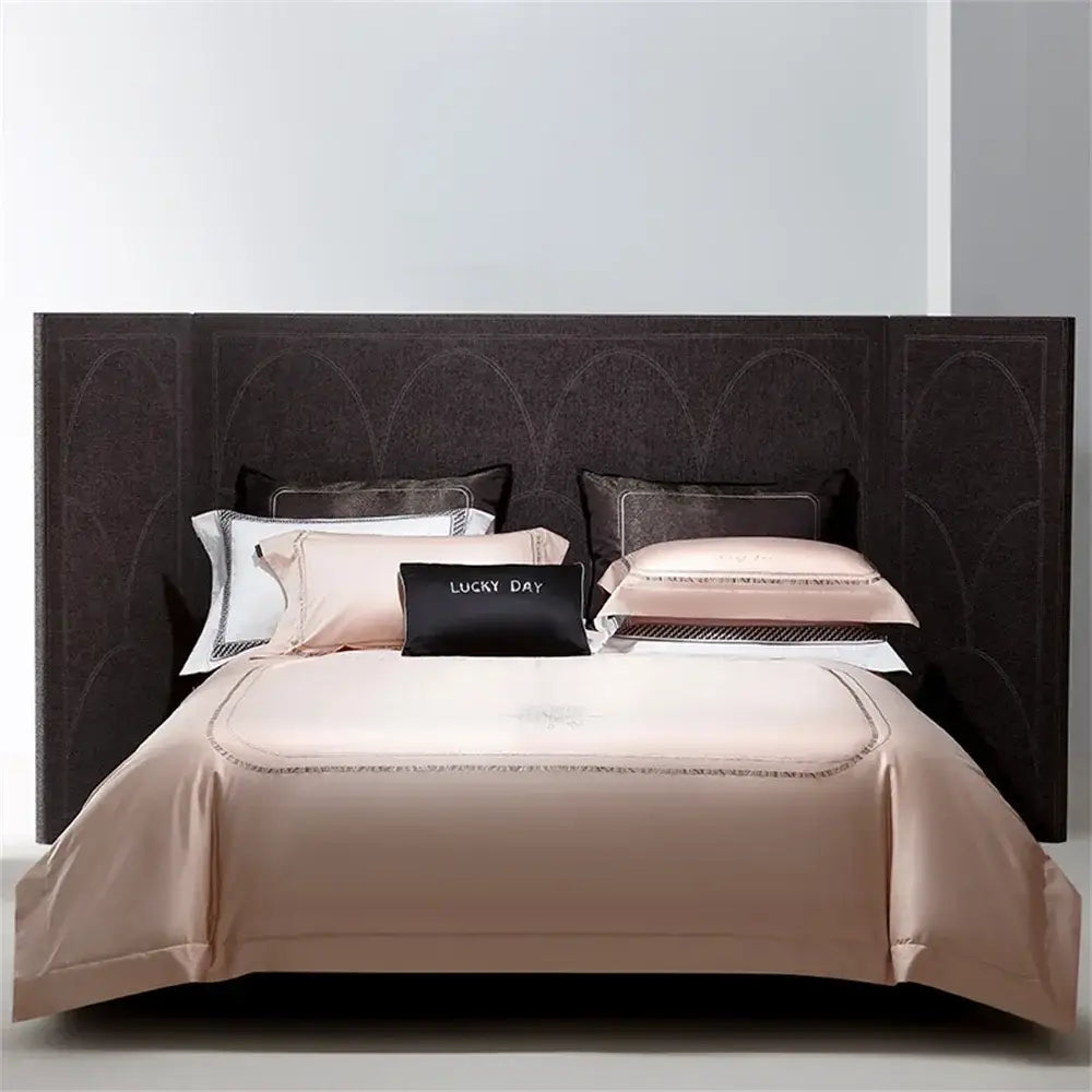 Luxurious blush silver cotton satin jacquard bedding set with gold-threaded embroidery and lucky day black accent pillow
