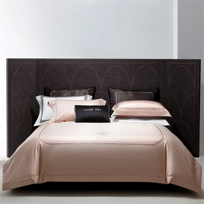 Luxurious blush silver cotton satin jacquard bedding set with gold-threaded embroidery and lucky day black accent pillow