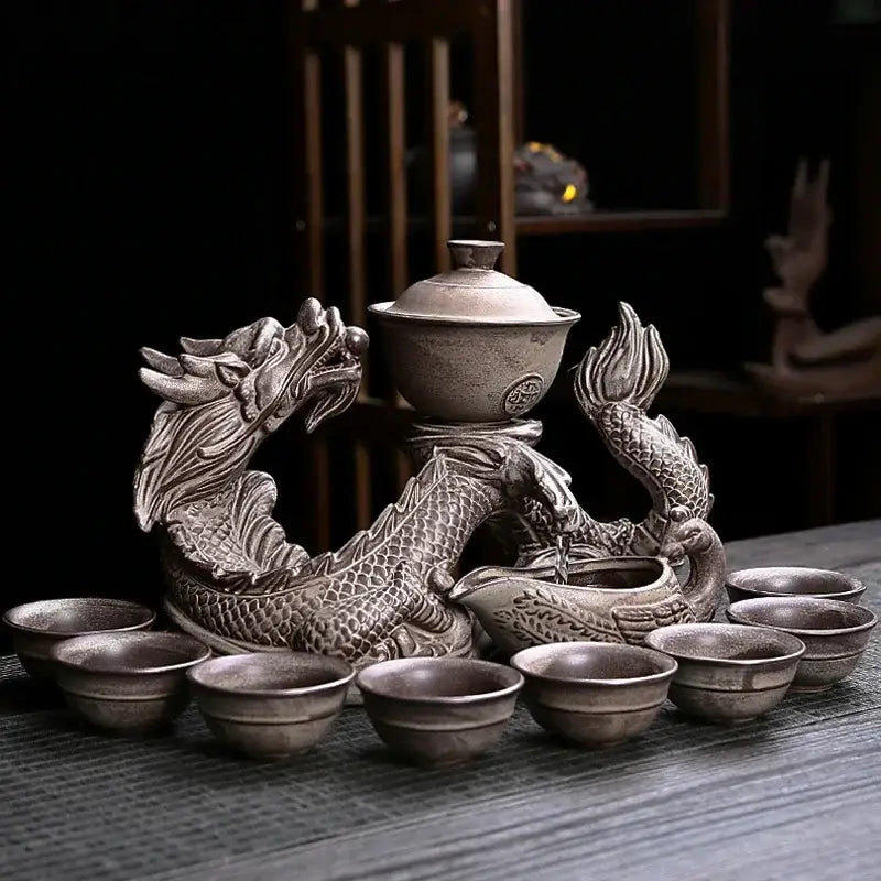 Silver dragon-shaped ceramic tea set with intricate scales and central teapot for decorbites dragon teapot set