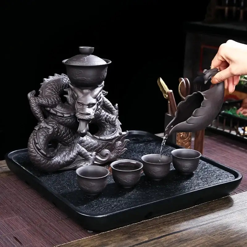 Dark gray ceramic decorbites dragon teapot set with intricately carved scales and a magnetic rotating teapot for tea set use