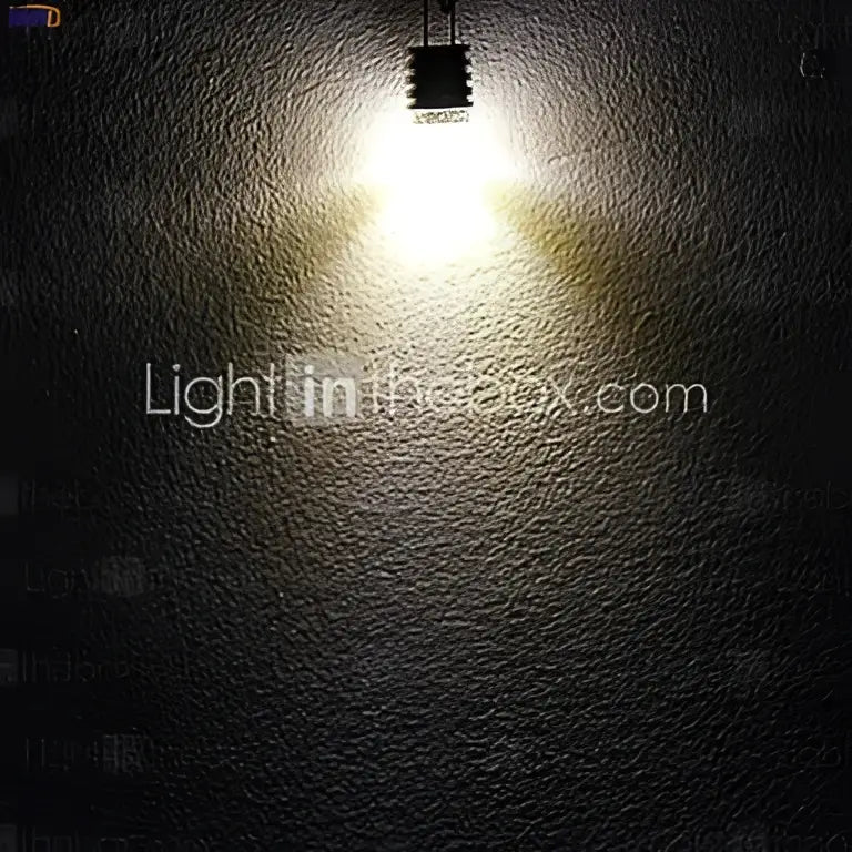 A bright white cob g4 led bulb with metallic base emitting warm light for chandelier dining room decorbites cob pack