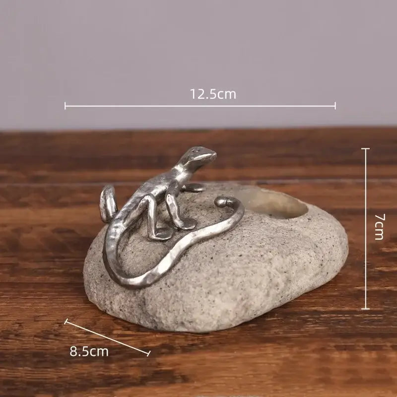Silver gecko lizard resin candlestick with textured gray stone base and circular opening for living room decorbites decor