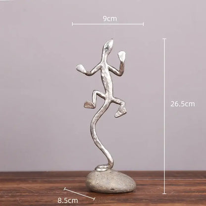 Silver gecko lizard resin figurine in mid-leap pose on textured stone base for decorbites gecko lizard decor