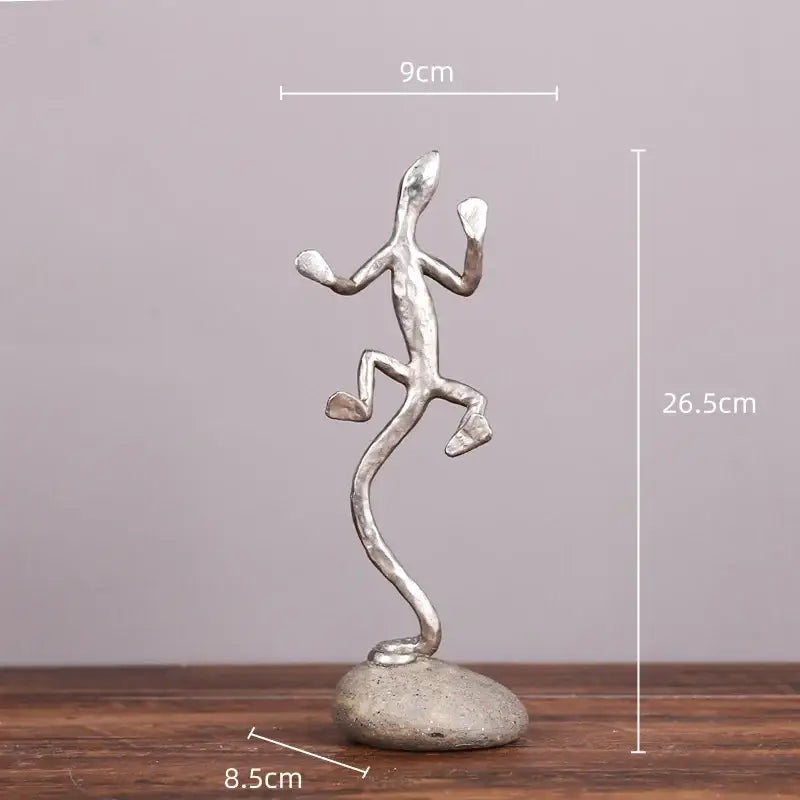 Silver gecko lizard resin figurine in mid-leap pose on textured stone base for decorbites gecko lizard decor