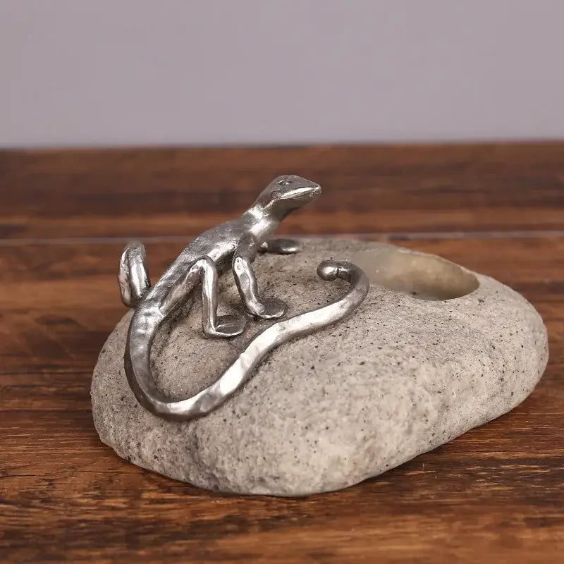Silver gecko lizard resin candlestick figurine with metallic finish on textured gray stone base for living room decorbites decor