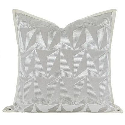 Silver geometric embroidery pillow cover with light gray fabric and decorbites conical geometric stitched pattern