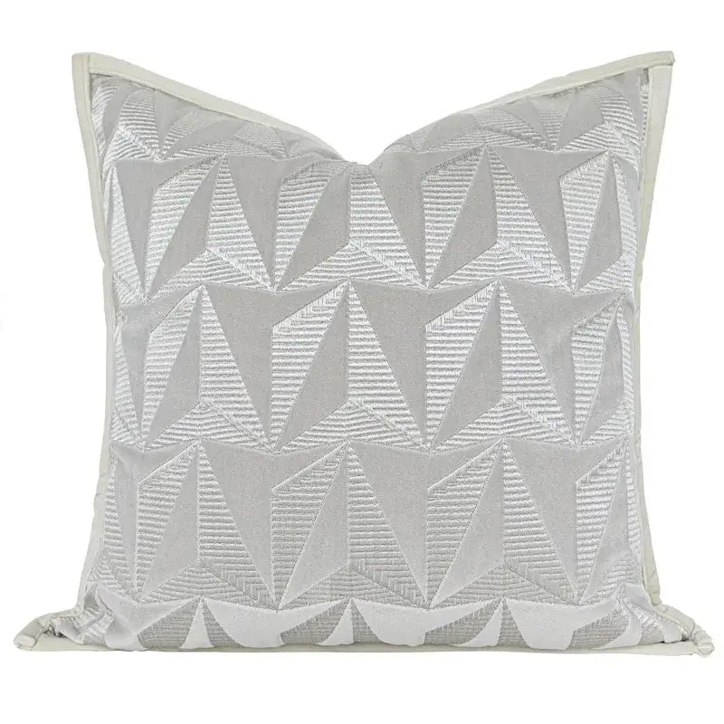 Silver geometric embroidery pillow cover with light gray fabric and decorbites conical geometric stitched pattern