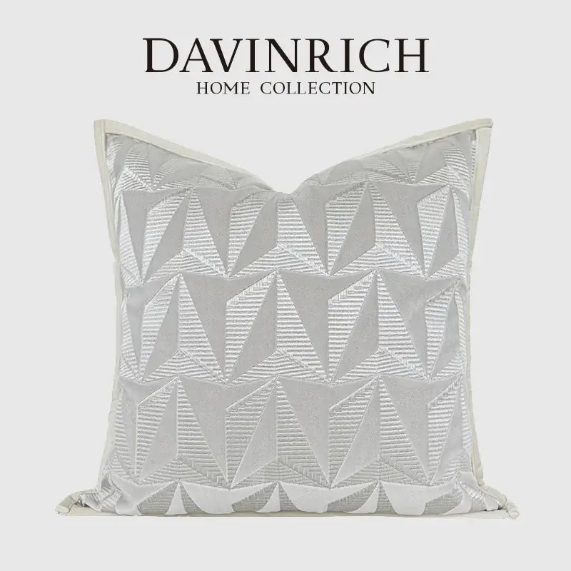 A silver-toned pillow cover with geometric embroidery from davinrich home collection for luxe living room decorbites style