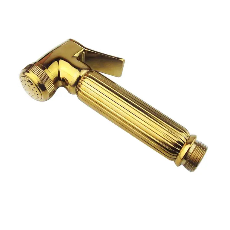 Gold-colored ribbed brass bidet sprayer with textured trigger and adjustable spray head from decorbites golden bidet collection
