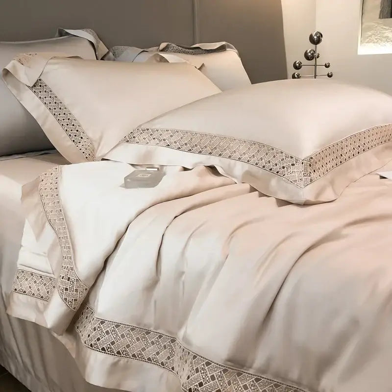 Cream-colored satin fiber summer quilt with silver-toned geometric lace trim from decorbites eucalyptus fiber set