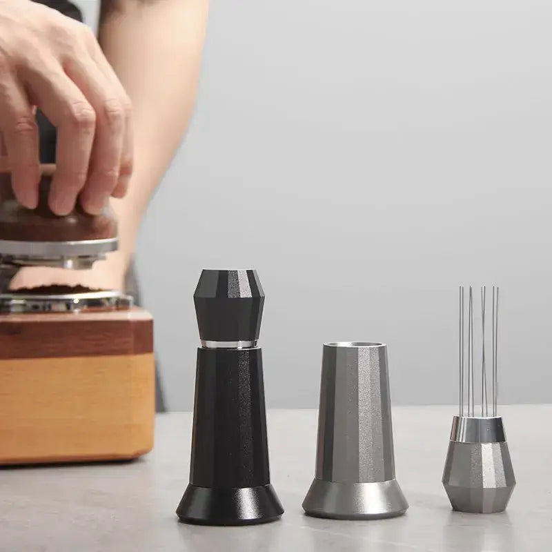 Black and silver metallic aluminum espresso distributor wdt tool with faceted geometric design for coffee tamping