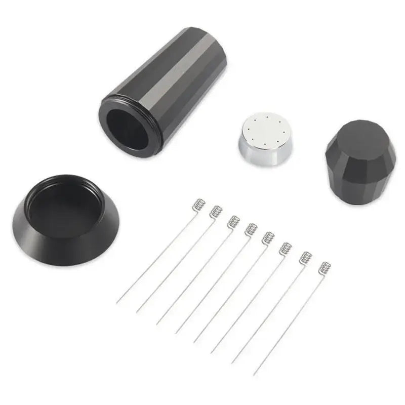Black cylindrical vape mod with faceted top cap and base alongside silver coil wires for espresso distributor wdt tool use