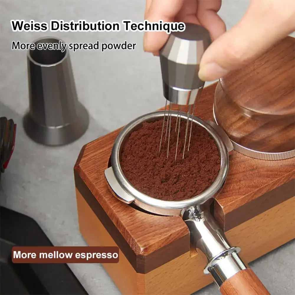 Silver hexagonal aluminum espresso distributor wdt tool with faceted handle pressing ground coffee in portafilter