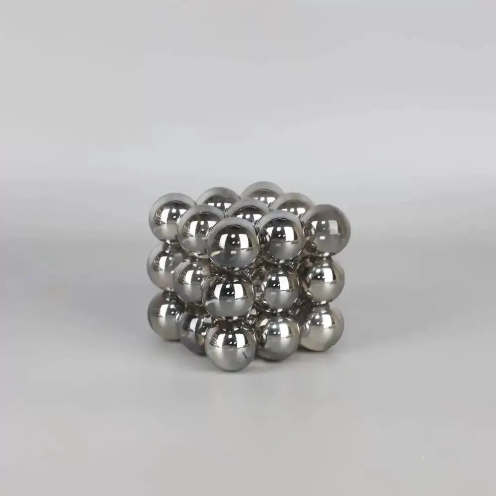 A cube-shaped stack blocks made of shiny silver crystal glass balls for living room decor