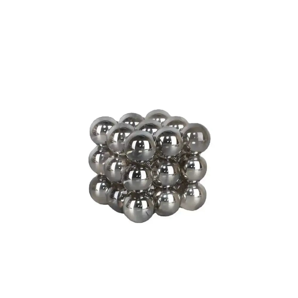 Silver metallic crystal glass ball stack blocks formed by magnetic spherical beads in a cubic living room decor design