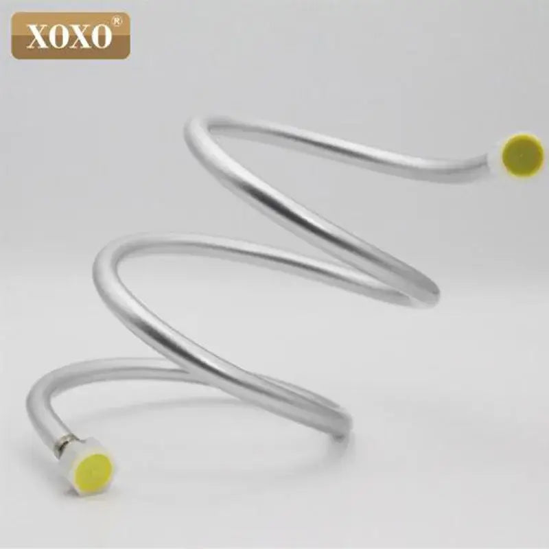 Silver pvc flexible shower hose with yellow caps and metallic spiral connector branded xoxo for bathroom use