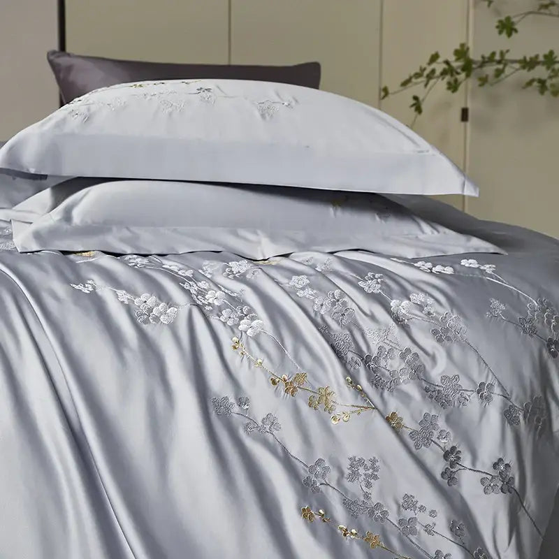 Silver-gray satin egyptian cotton bedding set with delicate white and gold cotton flowers embroidery design