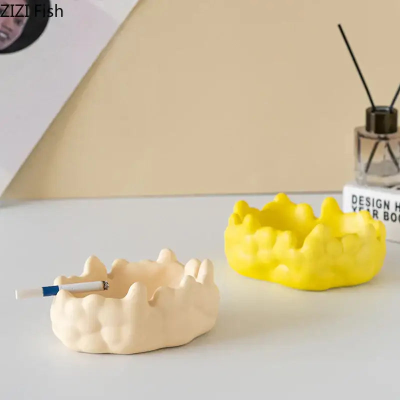 Cream-colored ceramic bubble clouds ashtray with textured crown-like design by decorbites for office smoking accessory