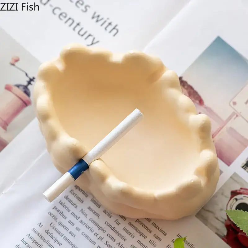 Cream-colored ceramic bubble clouds ashtray with textured rim and smooth interior for office smoking accessory decorbites