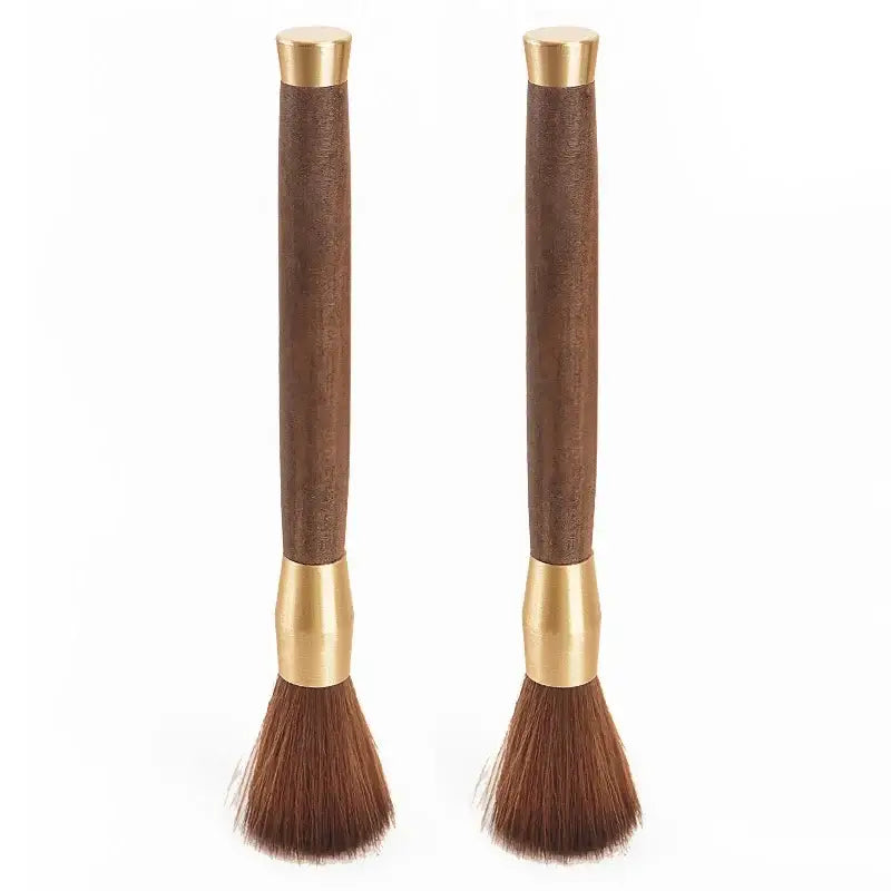 Pair of elegant brown wooden-handled espresso brushes with brass accents for coffee grinder cleaning and kitchen use