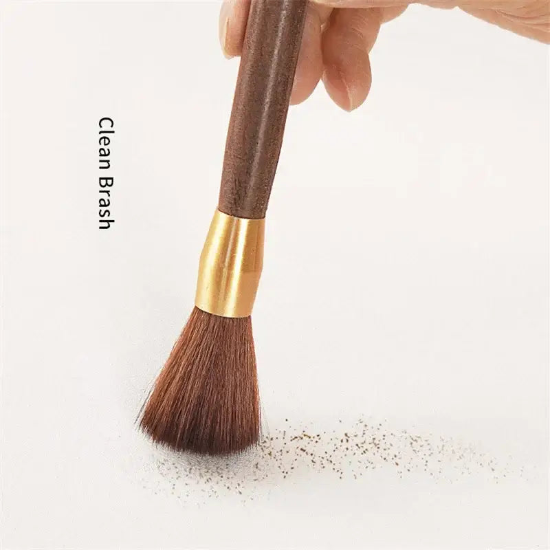 Silver textured espresso brush with brown wooden handle and soft dense bristles for coffee grinder cleaning