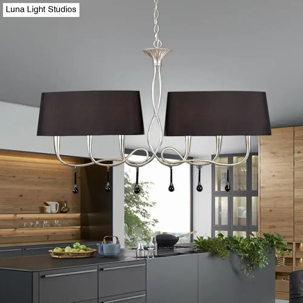 Silver twisted metal island chandelier with two black rectangular shades and teardrop pendants for dining room