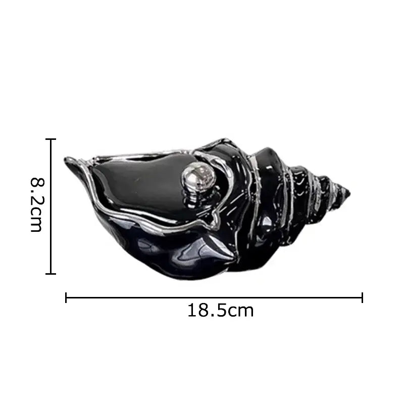 Black glossy ceramic conch ashtray with a silver metallic sphere for living room decor by decorbites conch ashtray