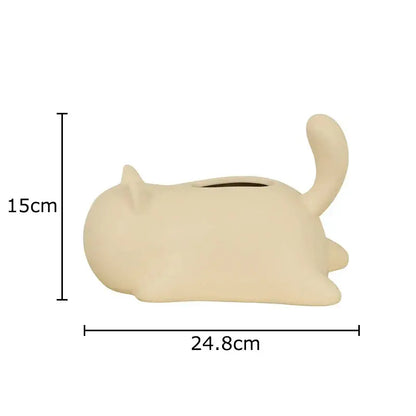 Cream-colored ceramic tissue box shaped like sleeping cat with matte finish for decorbites cat ceramic living room decor