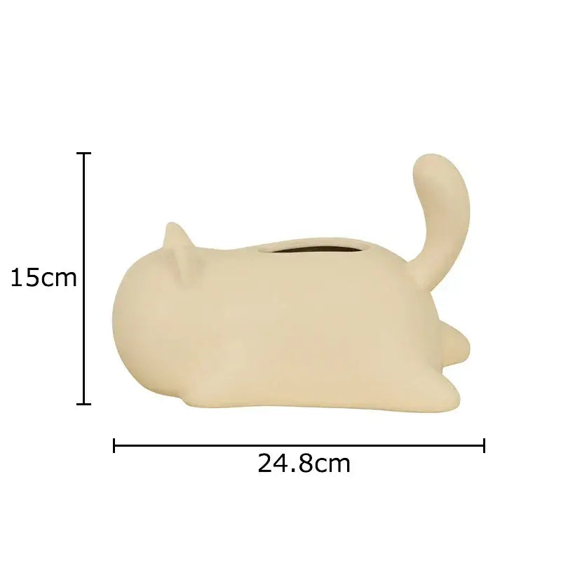 Cream-colored ceramic tissue box shaped like sleeping cat with matte finish for decorbites cat ceramic living room decor