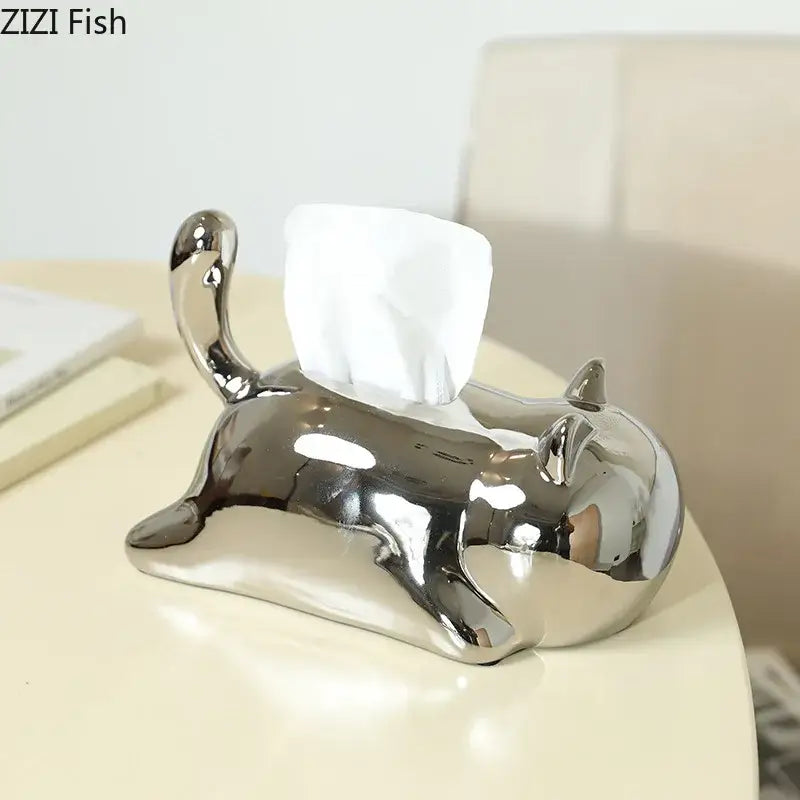 Silver and yellow decorbites cat ceramic tissue box holder with shiny finish and white tissue emerging from back