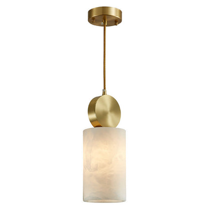 Brass pendant light with frosted glass shade and circular accents.