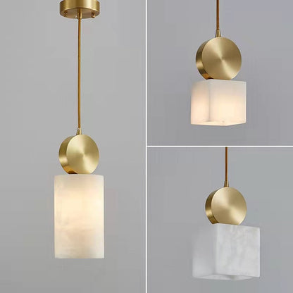 Brass and frosted glass pendant light with a modern design.