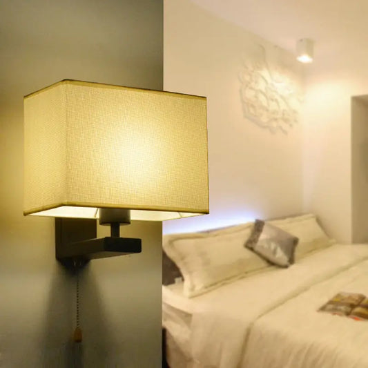 Simple beige fabric rectangle wall lamp with warm-toned textured shade and dark metal base e26 e27 light fixture