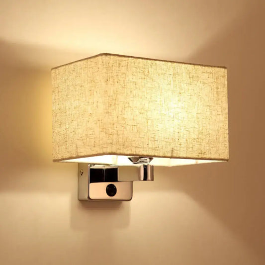 Beige fabric rectangular shade wall lamp mounted on sleek chrome fixture ideal for living room lighting