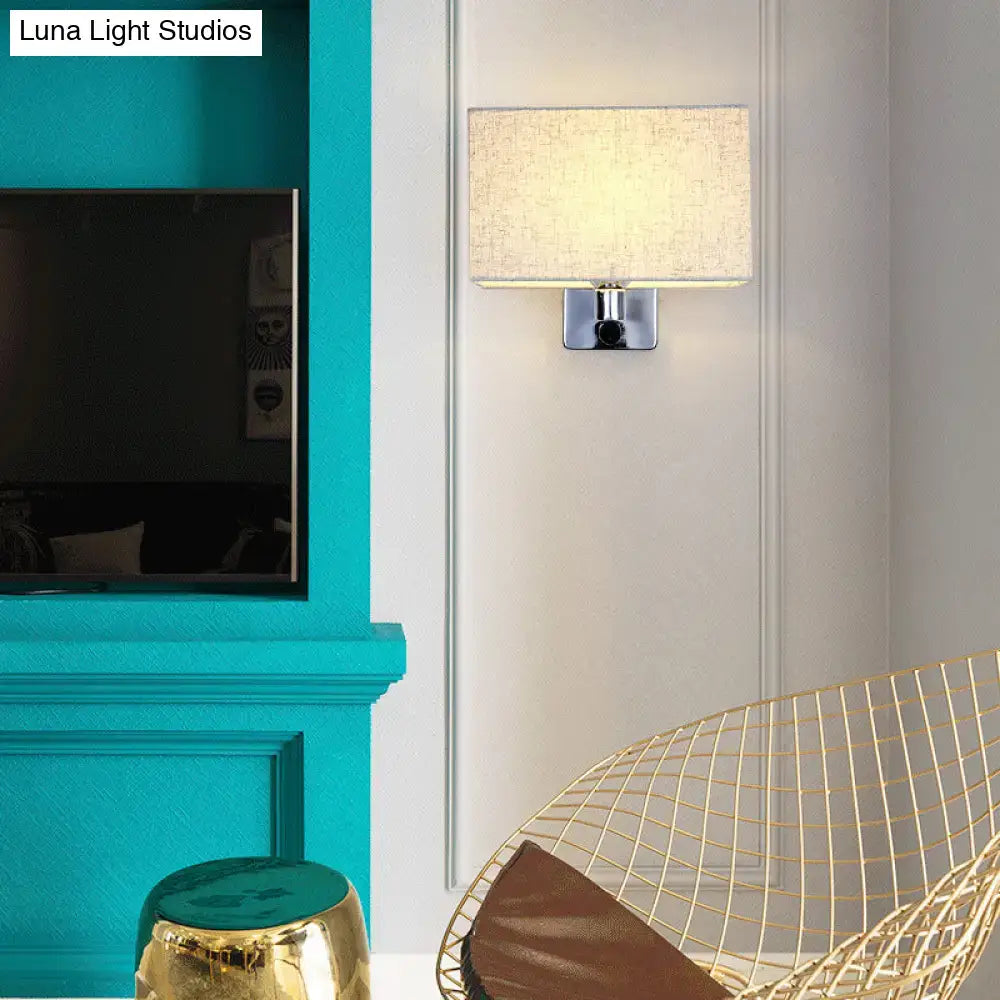 Modern rectangular wall lamp with beige fabric rectangular shade and chrome metal base for living room lighting
