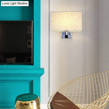 Modern rectangular wall lamp with beige fabric rectangular shade and chrome metal base for living room lighting