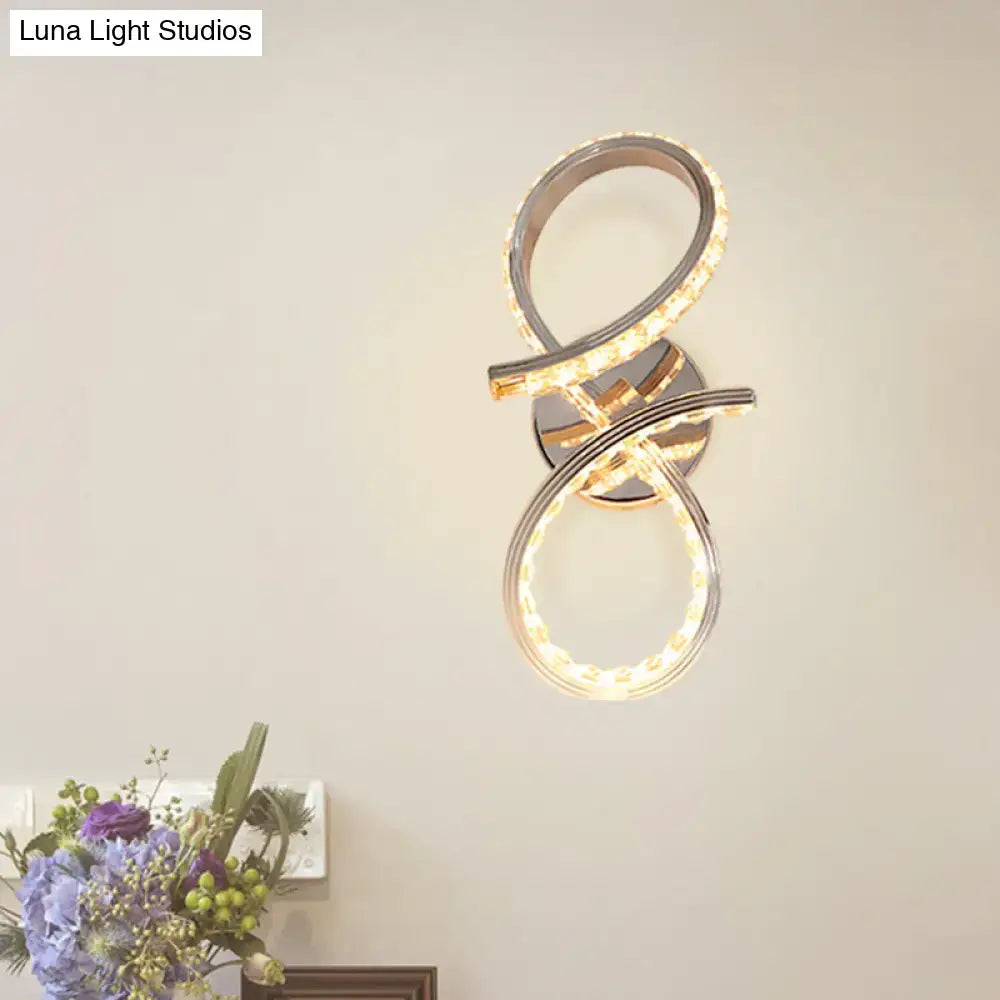 Simple led chrome infinity wall sconce with intertwined warm white light strips and cut crystal deco for bedroom use
