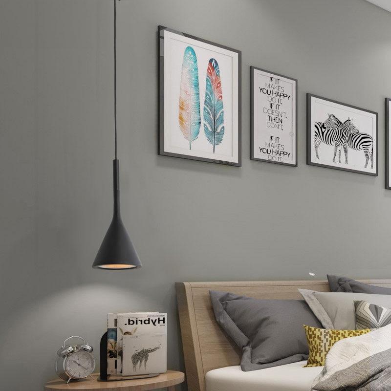 Black cone-shaped pendant light with minimalist design for simple single head chandelier lighting solution